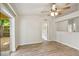 Bedroom with wood-look floors, ceiling fan and sliding glass door at 3795 Rachel St, Apopka, FL 32703