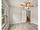 Bedroom featuring ceiling fan, wood floors, and window with lots of natural light at 3795 Rachel St, Apopka, FL 32703