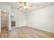 Bedroom with open doorway and wood-look flooring at 3795 Rachel St, Apopka, FL 32703