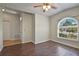 Living room featuring wood floors and a large window providing plenty of natural light at 3795 Rachel St, Apopka, FL 32703