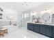 Luxurious bathroom with double vanity, soaking tub, glass shower, and modern finishes at 3891 Brantley Place Cir, Apopka, FL 32703
