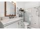 Bathroom showcasing a vanity with a marble countertop and shower behind glass doors at 3891 Brantley Place Cir, Apopka, FL 32703