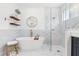 Stunning bathroom featuring a soaking tub, walk-in shower, and elegant marble accents at 3891 Brantley Place Cir, Apopka, FL 32703