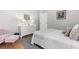 Bright bedroom featuring light gray walls, white dresser, a plush rug, and a large comfortable bed at 3891 Brantley Place Cir, Apopka, FL 32703