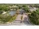 View of tennis court near the gated entrance of a residential community with manicured landscaping at 3891 Brantley Place Cir, Apopka, FL 32703