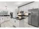Bright kitchen featuring modern appliances, granite countertops, and an island for added workspace at 3891 Brantley Place Cir, Apopka, FL 32703