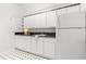 Kitchenette featuring white cabinets, black countertops, a sink, and a refrigerator at 3891 Brantley Place Cir, Apopka, FL 32703