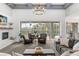 Inviting living room with seamless access to the pool area, creating an indoor-outdoor living experience at 3891 Brantley Place Cir, Apopka, FL 32703