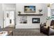 Bright and airy living room featuring a cozy fireplace and comfortable seating arrangement at 3891 Brantley Place Cir, Apopka, FL 32703