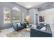 Bright living space with large windows, plush seating, and view of a home office at 3891 Brantley Place Cir, Apopka, FL 32703