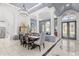 Open living and dining area with elegant columns and ample natural light at 3891 Brantley Place Cir, Apopka, FL 32703