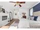 Large main bedroom features a fireplace, hardwood floors, sitting area, and natural light at 3891 Brantley Place Cir, Apopka, FL 32703