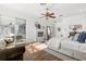 Sunlit main bedroom boasts hardwood floors, fireplace, sitting area, and access to a lanai at 3891 Brantley Place Cir, Apopka, FL 32703