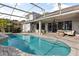 Beautiful backyard pool with patio, ceiling fan, grill, and plenty of seating at 3891 Brantley Place Cir, Apopka, FL 32703