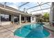 Beautiful backyard pool with patio and plenty of seating in an enclosed lanai at 3891 Brantley Place Cir, Apopka, FL 32703