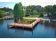 Aerial view of dock and beach with shade trees at 4141 Fallwood Cir, Orlando, FL 32812