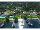 Aerial view of waterfront homes, docks, pools, and lush green trees at 4141 Fallwood Cir, Orlando, FL 32812