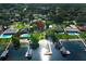 Expansive aerial view of waterfront homes featuring private docks and lush landscaping in a desirable neighborhood at 4141 Fallwood Cir, Orlando, FL 32812