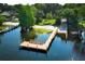 Aerial view of dock and beach with shade trees at 4141 Fallwood Cir, Orlando, FL 32812