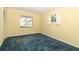 Sunny bedroom with blue carpet and a bright window at 4141 Fallwood Cir, Orlando, FL 32812