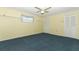 Bedroom with blue carpet and white closets in the yellow striped walls at 4141 Fallwood Cir, Orlando, FL 32812