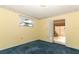 Bedroom featuring blue carpet, yellow walls, and floral border at 4141 Fallwood Cir, Orlando, FL 32812