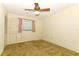 Neutral-toned bedroom with carpet, ceiling fan, and window at 4141 Fallwood Cir, Orlando, FL 32812