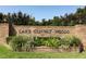 The brick entrance to Lake Conway Woods is beautifully landscaped with a variety of plants and greenery at 4141 Fallwood Cir, Orlando, FL 32812