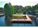 Wooden dock on a tranquil lake with clear water and waterfront park at 4141 Fallwood Cir, Orlando, FL 32812