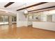 Bright kitchen boasts wooden beams, pendant lighting, and white cabinetry at 4141 Fallwood Cir, Orlando, FL 32812