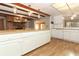 Spacious kitchen featuring white cabinets and a large butcher block island at 4141 Fallwood Cir, Orlando, FL 32812