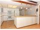 Bright kitchen with white cabinets, modern appliances, and a butcher block island at 4141 Fallwood Cir, Orlando, FL 32812
