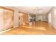 Large bright living room with hardwood floors and multiple sliding glass doors at 4141 Fallwood Cir, Orlando, FL 32812