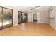 Bright living room with sliding glass doors and access to another room at 4141 Fallwood Cir, Orlando, FL 32812