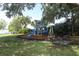 Community playground with a colorful play set and lakeside views at 4141 Fallwood Cir, Orlando, FL 32812