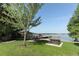 Community waterfront with picnic tables, a dock, and serene lakeside views at 4141 Fallwood Cir, Orlando, FL 32812