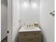 A half bathroom offers modern fixtures and a clean design at 4751 Aguila Pl, Orlando, FL 32826