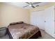 Bedroom featuring a ceiling fan, closet and neutral carpet at 4751 Aguila Pl, Orlando, FL 32826