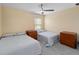 Bedroom featuring two twin beds and matching nightstands at 4751 Aguila Pl, Orlando, FL 32826
