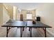 Bonus room with luxury vinyl plank floors, a staircase, a ping pong table, and a massage table at 4751 Aguila Pl, Orlando, FL 32826