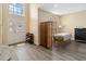 Bright foyer with high ceilings, luxury vinyl plank flooring, a staircase, and a front door with stained glass at 4751 Aguila Pl, Orlando, FL 32826