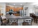 The kitchen offers a breakfast bar, stainless steel appliances, and plenty of cabinet space at 4751 Aguila Pl, Orlando, FL 32826