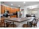 The kitchen offers a breakfast bar, stainless steel appliances, and plenty of cabinet space at 4751 Aguila Pl, Orlando, FL 32826