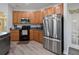 The kitchen features modern appliances and ample counter space at 4751 Aguila Pl, Orlando, FL 32826