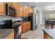The kitchen features modern appliances and a seamless flow into the dining area at 4751 Aguila Pl, Orlando, FL 32826