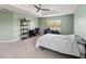 Bright main bedroom featuring neutral paint, large window, and ceiling fan at 4751 Aguila Pl, Orlando, FL 32826