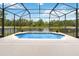 Screened pool with beautiful water view, fountains, and a spacious patio area for entertaining or relaxing at 4751 Aguila Pl, Orlando, FL 32826