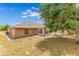 Wide view of the backyard showcases its size, landscaping, and the home's rear facade at 514 Richmond Ave, Deltona, FL 32725