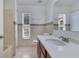 Well-maintained bathroom featuring tile flooring, shower-tub combination, and bright vanity lighting at 514 Richmond Ave, Deltona, FL 32725