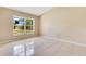 Spacious bedroom with tile flooring, natural light, and a neutral color palette at 514 Richmond Ave, Deltona, FL 32725